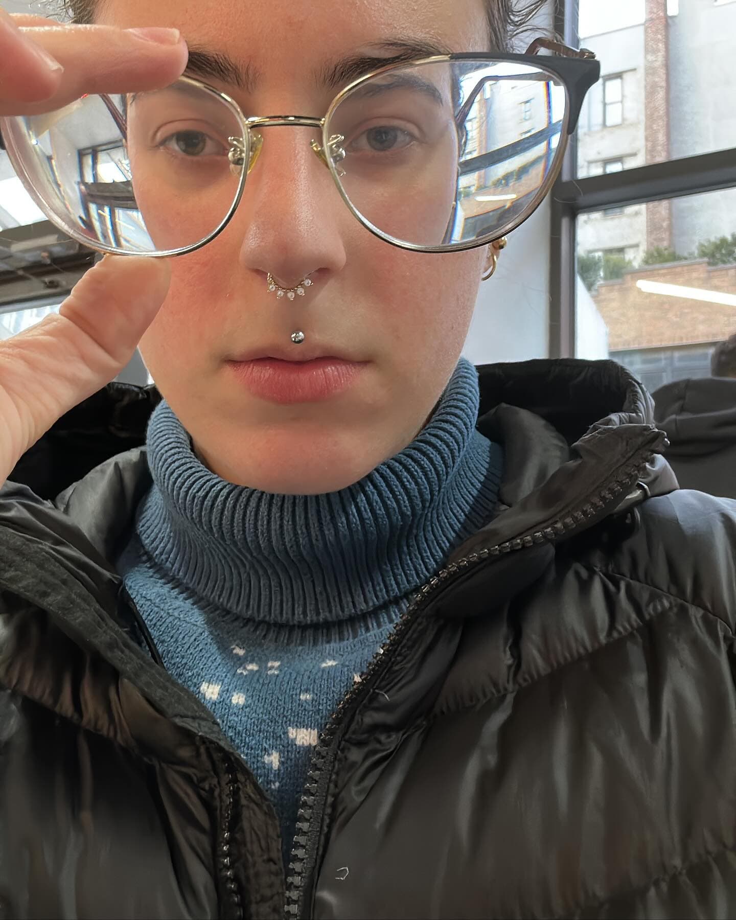 Close portrait of Toni Mueller wearing glasses